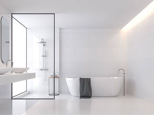Bright white bathroom with freestanding bath and walk-in shower